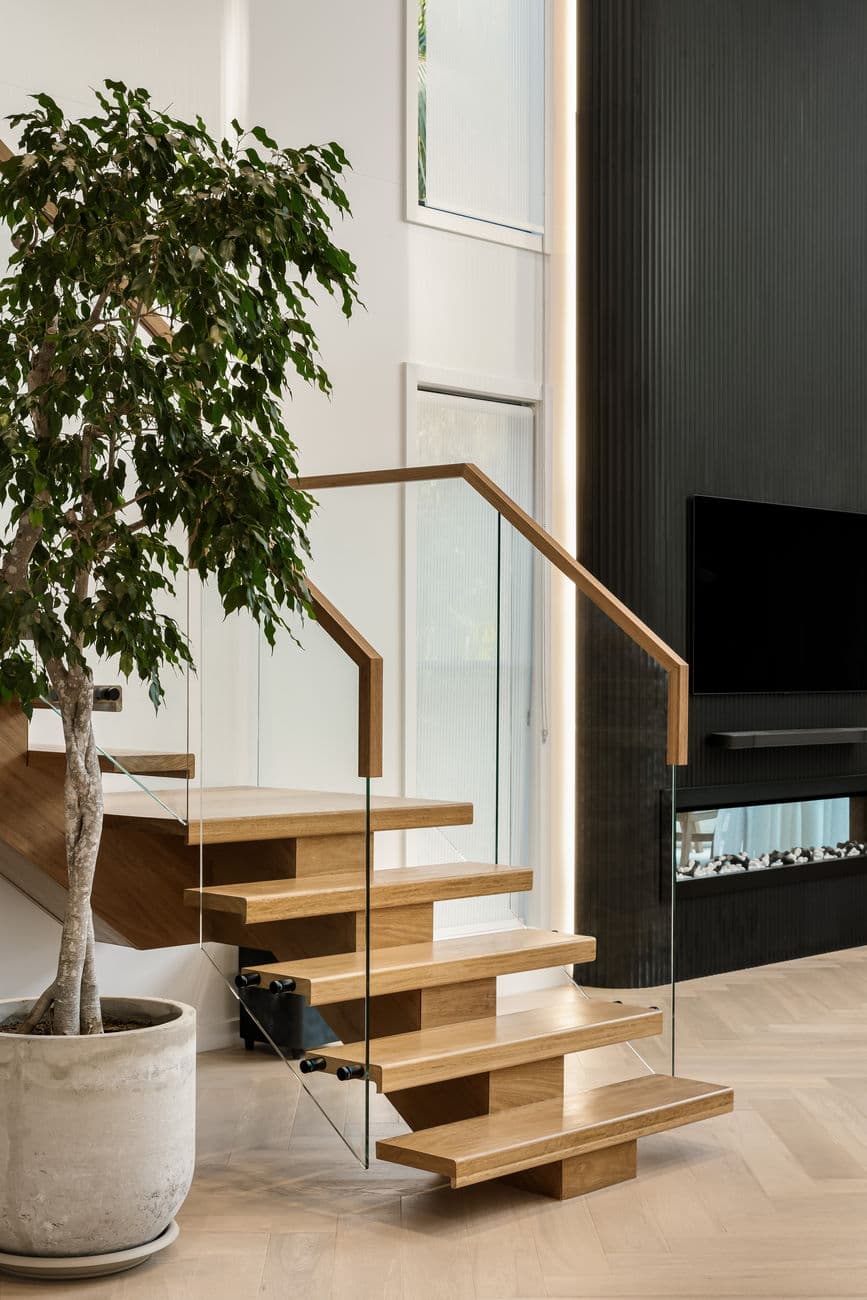 Floating timber stair with frameless glass balustrade